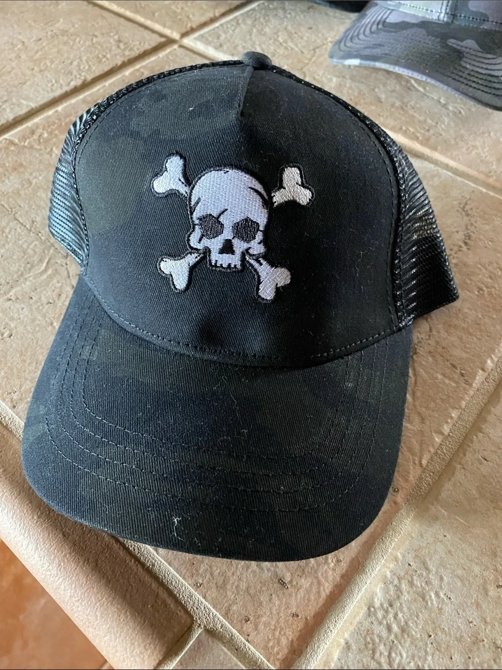Men’s Black Trucker Hat with White Skull Patch